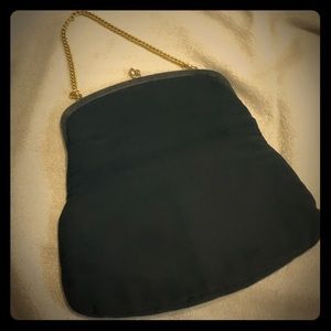 VNT black fold over clutch with gold chain